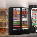 A two-section swing glass door commercial merchandiser refrigerator with drinks and beverages on shelves in the restaurant scene
