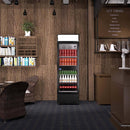 A swing glass door commercial merchandiser refrigerator with drinks and beverages on shelves in the restaurant scene